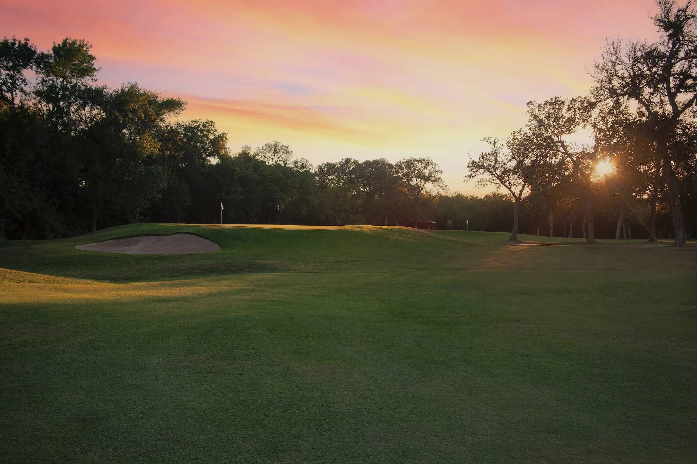 Hole 18 fairway with signature railroad bridge crossing